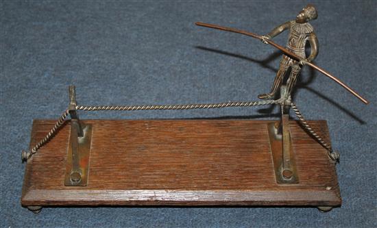 A group of circus items comprising a bronze of a trapeze artist,